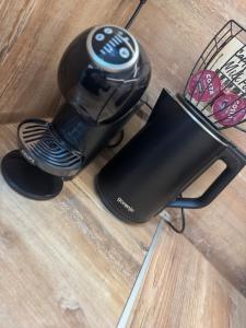 a hair dryer sitting on top of a wooden floor at Kamberovi house Kalofer in Kalofer