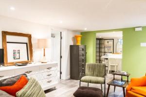 a living room with a couch and a table at L'Adresse Botanique - Studio in Montréal