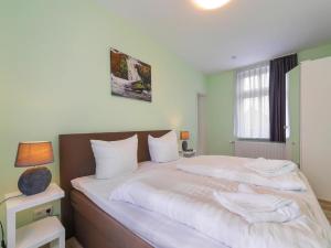 Una cama o camas en una habitación de Ferienwohnung Remise, Wernigerode