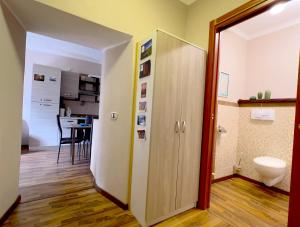 a hallway with a door to a room with a kitchen at Dascio Lakefront with Private Garden and Parking in Dascio