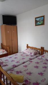 Postel nebo postele na pokoji v ubytování Maja Apartman