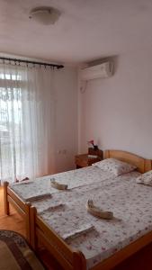 Postel nebo postele na pokoji v ubytování Maja Apartman