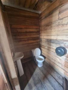an overhead view of a bathroom with a toilet and sink at Las delicias del paraiso in El Palo Verde