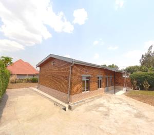 a red brick building with a lot at Home2home in Kigali