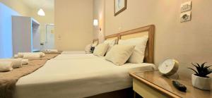 Postel nebo postele na pokoji v ubytování Koulouris Beach Hotel