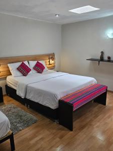 Voodi või voodid majutusasutuse Xplora Hostel Cusco toas
