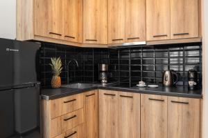 A kitchen or kitchenette at Depalyma Suites