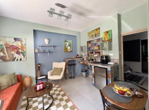 a living room with a couch and a table at Casa dell'Arte in Volos