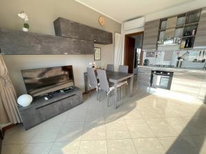 a kitchen with a dining table and a fireplace at Alba sul Lago in Lenno +37 photos