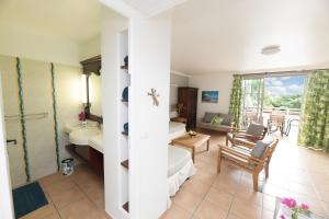 Et tv og/eller underholdning på Passion Martinique T3 Magnifique Village Vacances 6 pers 72m2