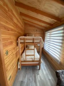 Postel nebo postele na pokoji v ubytování Cabañas Camping Río Fuy