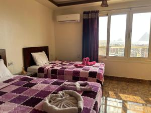 Vuode tai vuoteita majoituspaikassa Giza Pyramids View Guest house