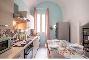 a kitchen with a counter and a refrigerator at White Sand in Gallipoli