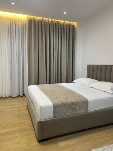Postel nebo postele na pokoji v ubytování Skanderbeg Hotel