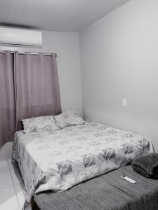 Ένα ή περισσότερα κρεβάτια σε δωμάτιο στο Casa confortável e completa para sua estadia na COP 30