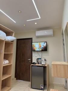 TV a/nebo společenská místnost v ubytování LE Grand Pyramids View & Suites
