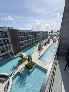 an overhead view of a swimming pool on a building at Porto Alto Gav Resorts in Porto De Galinhas