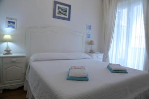 Ένα ή περισσότερα κρεβάτια σε δωμάτιο στο Villa con giardino a pochi passi dal mare