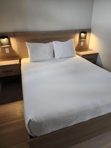 Postel nebo postele na pokoji v ubytování Paradise Motel