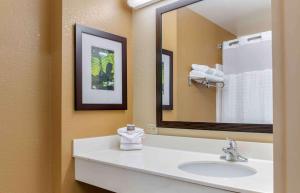 a bathroom with a sink and a large mirror at Extended Stay America Suites - Columbus - NE - I-270 in Gahanna +47 photos