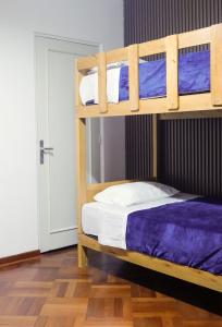 Ένα ή περισσότερα κρεβάτια σε δωμάτιο στο Gutierrez Hostel