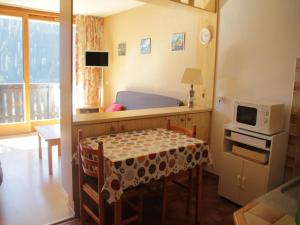 a small room with a table and a microwave at Apartment for 4 people in Chatel in Châtel