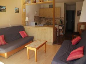 a living room with a couch and a table at Apartment for 4 people in Chatel in Châtel