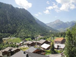 a village in a valley with mountains in the background at Apartment for 4 people in Chatel in Châtel +10 photos