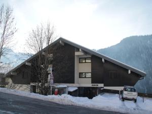 a house with a car parked in front of it at Apartment for 4 people in Chatel in Châtel