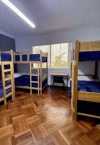 Ένα ή περισσότερα κρεβάτια σε δωμάτιο στο Gutierrez Hostel