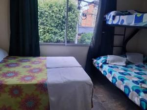 Postel nebo postele na pokoji v ubytování Hotel escorpion