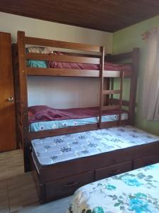 a bedroom with two bunk beds and a bed at Vicenzo in Melo