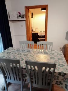 a table with chairs and a table and a kitchen at The Studio in Dublin +5 photos