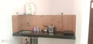 Kuchyň nebo kuchyňský kout v ubytování Richnest Apartment Colva Beach