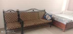 Postel nebo postele na pokoji v ubytování Richnest Apartment Colva Beach