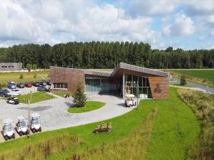 an aerial view of a building with a parking lot at Forest View Escape for Two in Antoing +11 photos