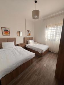 Ένα ή περισσότερα κρεβάτια σε δωμάτιο στο Privado by Manazil, 6A,Luxury Open View Stay in Privado!