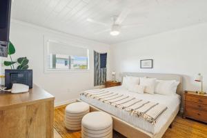 a bedroom with a large bed and a desk at Grayt Days By Stay on 30A, Gulf View, 2 Bikes in Santa Rosa Beach