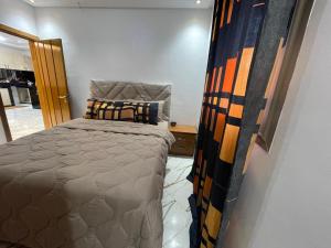 a bedroom with a bed in a room at maison cotiére in Iterkine