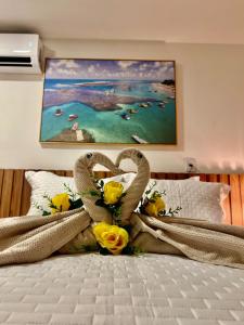 Ένα ή περισσότερα κρεβάτια σε δωμάτιο στο Flat Luxuoso Porto de Galinhas Cupe Exclusive #403