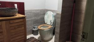a bathroom with a toilet and a sink at Tiki camping, petit déjeuner offert in Bora Bora +6 photos