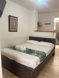Letto o letti in una camera di Hotel Portal Guatapé