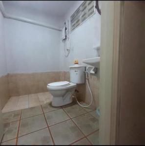 a bathroom with a toilet and a sink at Phangan Cosy Bungalow - ban tai in Baan Tai