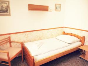 Tempat tidur dalam kamar di Penzion Ráj