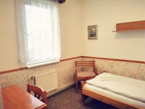 Tempat tidur dalam kamar di Penzion Ráj