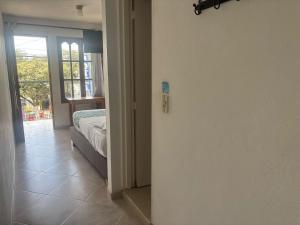 Letto o letti in una camera di Hotel Portal Guatapé