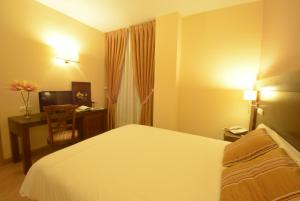 Postel nebo postele na pokoji v ubytování Hotel Campos de Castilla