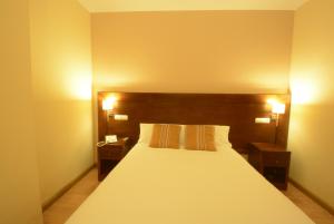 Postel nebo postele na pokoji v ubytování Hotel Campos de Castilla