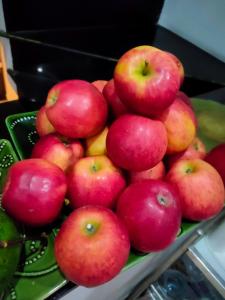a pile of red apples sitting on a tray at Huong's Homestay in Ho Chi Minh City