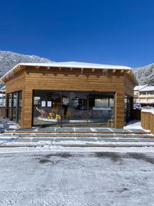 a store front of a building in the snow at Appartement Cosy Tout Confort in Les Angles